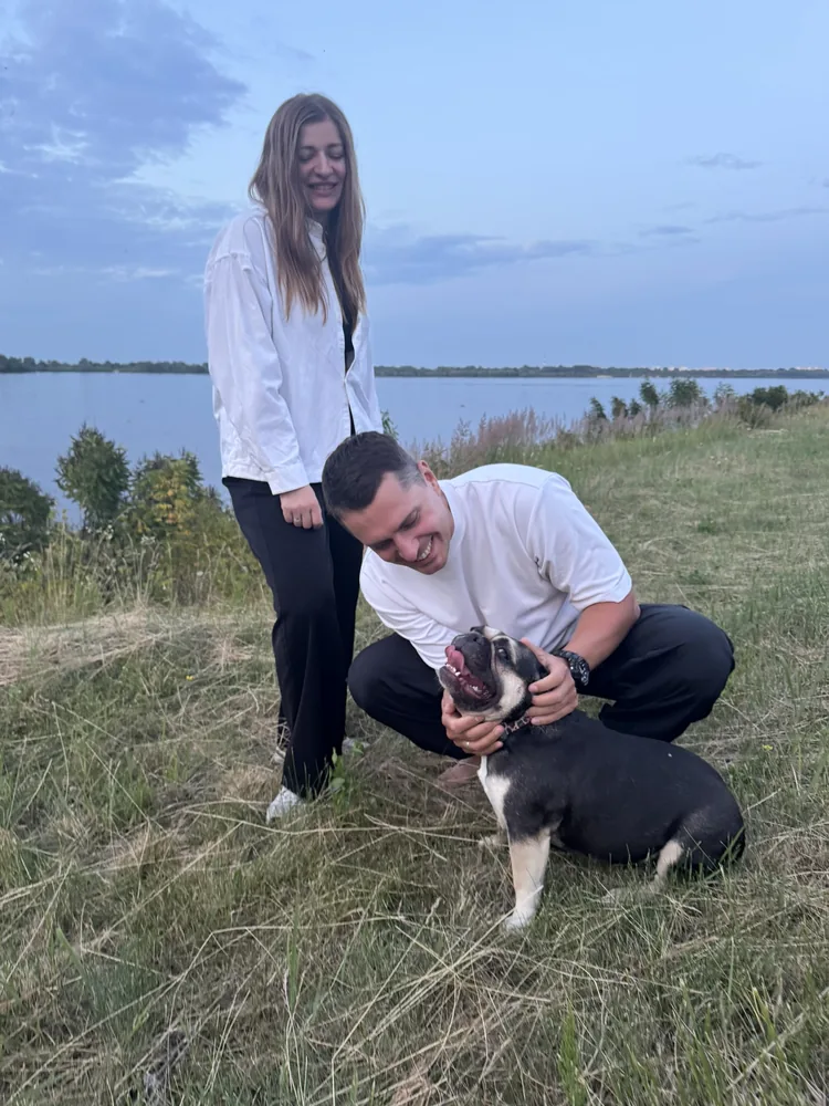 Yevhen Bulhakov outdoors with his dog